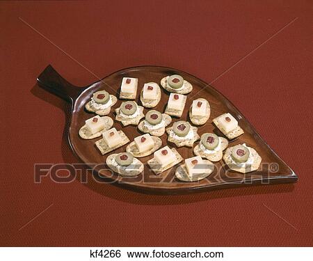 Crackers With Cheese And Olives On Serving Plate View Large Photo Image Stock Photograph - Crackers With Cheese And Olives On Serving Plate. Fotosearch