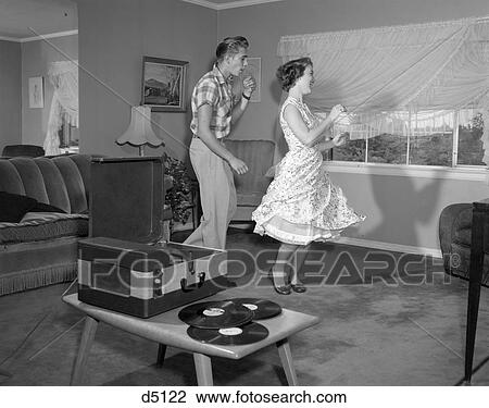 Stock Photo of 1950S Laughing Teenage Couple Dancing To The Phonograph ...