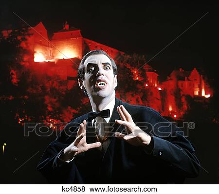 Man In Vampire Makeup And Costume Gesturing Menacingly Castle Background Studio Superstition Folklore View Large Photo Image Stock Photo - Man In Vampire Makeup And Costume Gesturing Menacingly Castle Background Studio Superstition Folklore . Fotosearch