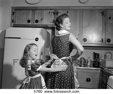 Woman Child Daughter Mother Apron Kitchen Retro 1950S View Large Photo Image Stock Image - Woman Child Daughter Mother Apron Kitchen Retro 1950S. Fotosearch