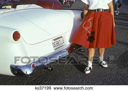 Woman In Red Poodle Skirt And Saddle Shoes Next To White 1950S Car View Large Photo Image Stock Photo - Woman In Red Poodle Skirt And Saddle Shoes Next To White 1950S Car . Fotosearch