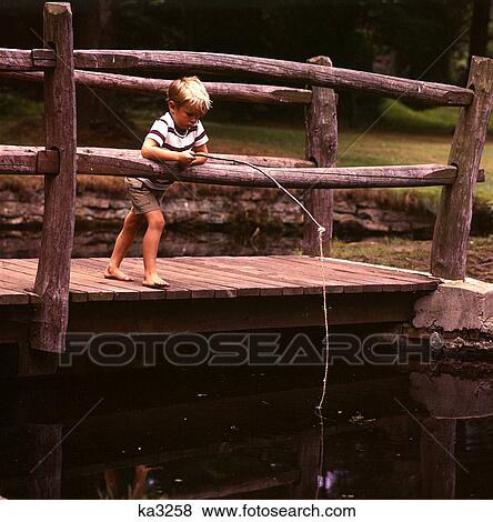 1960 1960S Barefoot Blonde Blond Boy Wooden Bridge Fishing Pole Pond Stream Retro View Large Photo Image Stock Photo - 1960 1960S Barefoot Blonde Blond Boy Wooden Bridge Fishing Pole Pond Stream Retro . Fotosearch