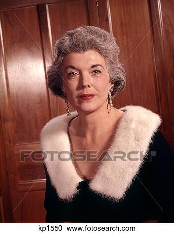1960 1960S Elegant Senior Elderly Woman Silver Hair Formal Black Sweater White Fur Ermine Collar Earrings View Large Photo Image Stock Image - 1960 1960S Elegant Senior Elderly Woman Silver Hair Formal Black Sweater White Fur Ermine Collar Earrings . Fotosearch