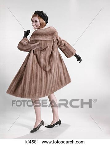 1960 1960S Full Figure Woman Wearing Fur Mink Coat Fashion Clothes On White Seamless Style Cowl Collar Retro View Large Photo Image Stock Image - 1960 1960S Full Figure Woman Wearing Fur Mink Coat Fashion Clothes On White Seamless Style Cowl Collar Retro . Fotosearch