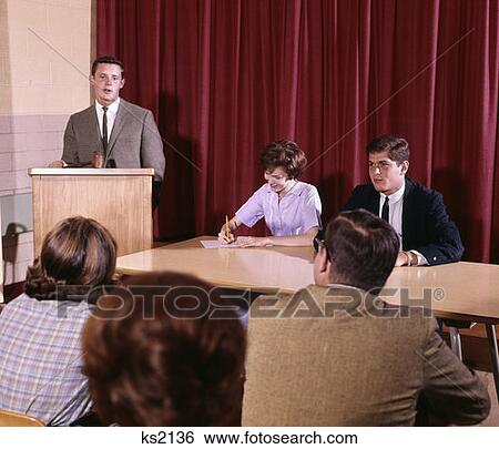1960 1960S Male Student At Podium Panel Class Debate Public Speaking Student Government Study Education Retro View Large Photo Image Stock Photograph - 1960 1960S Male Student At Podium Panel Class Debate Public Speaking Student Government Study Education Retro . Fotosearch