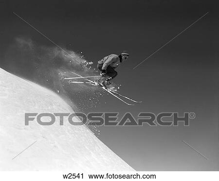 1960 1960S Man Skiing Downhill Jumping In Air Midair Mid-Air Winter Sports Ski Skis Sport Sports Snow View Large Photo Image Stock Image - 1960 1960S Man Skiing Downhill Jumping In Air Midair Mid-Air Winter Sports Ski Skis Sport Sports Snow. Fotosearch