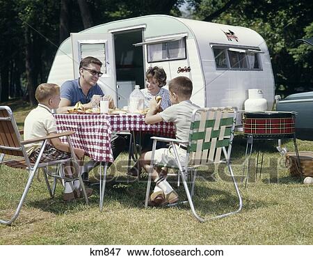 1960 1960S Retro Family Camping Trailer Rv Picnic Lawn Chair Bbq Grill View Large Photo Image Stock Photo - 1960 1960S Retro Family Camping Trailer Rv Picnic Lawn Chair Bbq Grill. Fotosearch