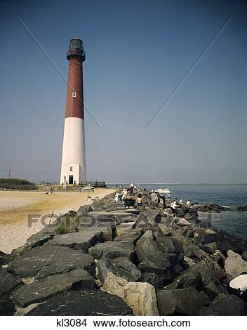 1960 1960S Retro Lighthouse Barnegat Light New Jersey Shore Rocks People Atlantic View Large Photo Image Picture - 1960 1960S Retro Lighthouse Barnegat Light New Jersey Shore Rocks People Atlantic. Fotosearch