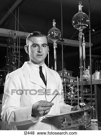 1960 1960S Retro Man Scientist Conducting A Litration View Large Photo Image Stock Photo - 1960 1960S Retro Man Scientist Conducting A Litration . Fotosearch