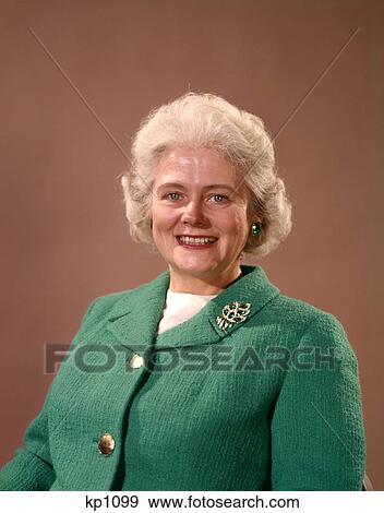 1960 1960S Smiling Mature Senior Elderly Woman Silver Hair Green Wool Jacket Pin Brooch Women Seniors Portrait View Large Photo Image Stock Photo - 1960 1960S Smiling Mature Senior Elderly Woman Silver Hair Green Wool Jacket Pin Brooch Women Seniors Portrait . Fotosearch