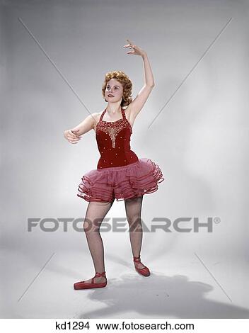 1960 1960S Teen Girl Red Velvet & Pink Net Tutu Ballet Costume Dance Pose Awkward Dancer View Large Photo Image Picture - 1960 1960S Teen Girl Red Velvet & Pink Net Tutu Ballet Costume Dance Pose Awkward Dancer. Fotosearch