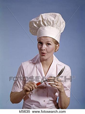 1960A Woman Cook Wear Hat Toque Hold Spoon Worried Expression View Large Photo Image Stock Photography - 1960A Woman Cook Wear Hat Toque Hold Spoon Worried Expression. Fotosearch