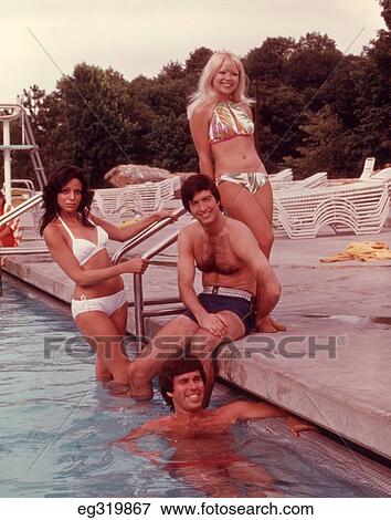 1960S 1970S Group Of Young People By Ladder Of Swimming Pool View Large Photo Image Stock Photo - 1960S 1970S Group Of Young People By Ladder Of Swimming Pool. Fotosearch
