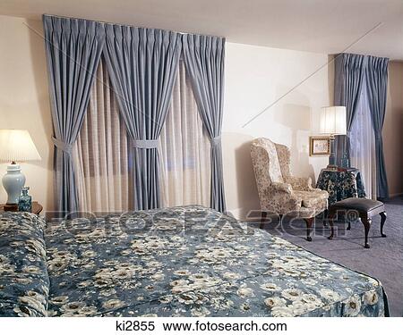 1960S 1970S Interior Bedroom Blue Curtains Floral Bedspread Blue Carpet Chairs Cherrywood Apartments Blackwood, Nj View Large Photo Image Stock Photography - 1960S 1970S Interior Bedroom Blue Curtains Floral Bedspread Blue Carpet Chairs Cherrywood Apartments Blackwood, Nj. Fotosearch