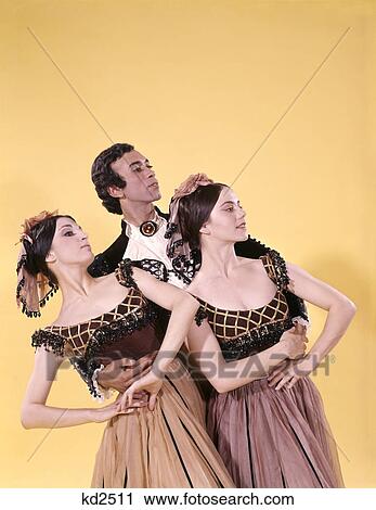 Stock Image - 1960S 1970S Spanish Ballet Dancer Man Two Women Costumes Posed Together. Fotosearch