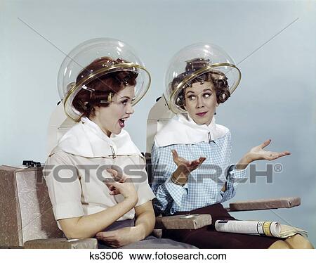 1960S 2 Women Sit Under Beauty Salon Hair Dryers Clear Helmets Hoods Curlers Talking Gossip View Large Photo Image Stock Photograph - 1960S 2 Women Sit Under Beauty Salon Hair Dryers Clear Helmets Hoods Curlers Talking Gossip. Fotosearch