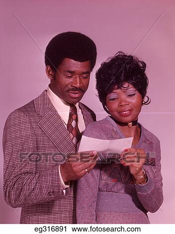 1960S African-American Couple Looking At Check View Large Photo Image Stock Image - 1960S African-American Couple Looking At Check. Fotosearch
