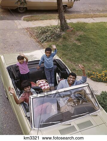 1960S African-American Family With Son And Daughter Waving From Convertible Car Man Woman Boy Girl Happy View Large Photo Image Stock Image - 1960S African-American Family With Son And Daughter Waving From Convertible Car Man Woman Boy Girl Happy. Fotosearch