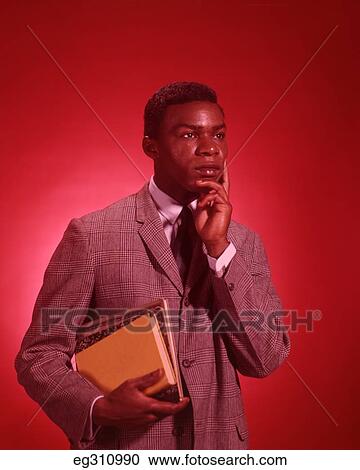 1960S African-American Male Student Carrying Books View Large Photo Image Stock Image - 1960S African-American Male Student Carrying Books. Fotosearch