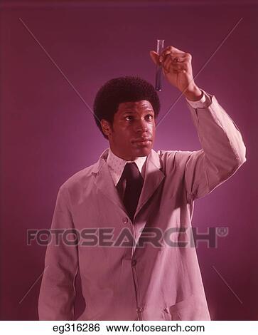 1960S African-American Man Holding Test Tube View Large Photo Image Stock Photograph - 1960S African-American Man Holding Test Tube. Fotosearch