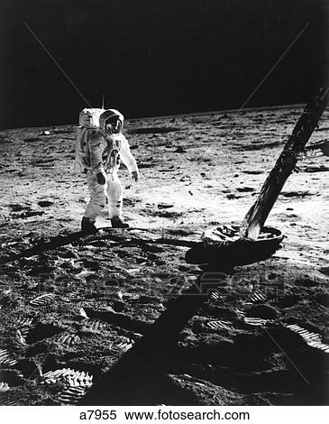 1960S Astronaut Buzz Aldrin In Space Suit Walking On The Moon Near The Apollo 2 Lunar Module Craters View Large Photo Image Stock Photography - 1960S Astronaut Buzz Aldrin In Space Suit Walking On The Moon Near The Apollo 2 Lunar Module Craters . Fotosearch