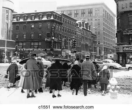 1960S Back View Of Small Crowd Of Men & Women Crossing City Street At Intersection In Winter Snow & Slush View Large Photo Image Stock Image - 1960S Back View Of Small Crowd Of Men & Women Crossing City Street At Intersection In Winter Snow & Slush . Fotosearch