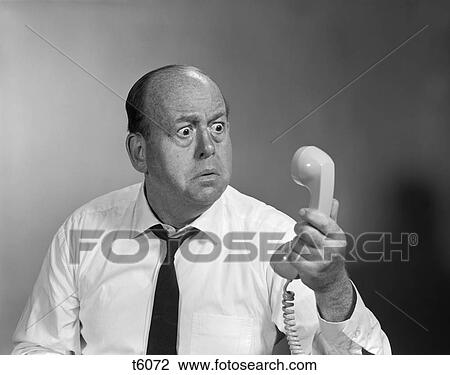 1960S Balding Man Looking Angry Into Telephone Receiver View Large Photo Image Stock Image - 1960S Balding Man Looking Angry Into Telephone Receiver . Fotosearch