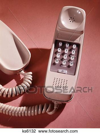 1960S Beige Trim Line Push Button Bell System Western Electric Telphone Hand Set Receiver Retro Telecommunications View Large Photo Image Stock Image - 1960S Beige Trim Line Push Button Bell System Western Electric Telphone Hand Set Receiver Retro Telecommunications . Fotosearch