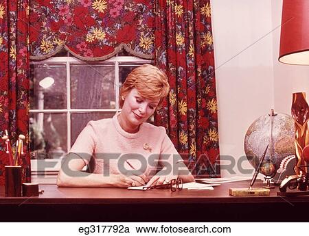 1960S Blond Middle-Aged Woman At Home Desk Writing View Large Photo Image Stock Image - 1960S Blond Middle-Aged Woman At Home Desk Writing. Fotosearch