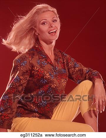 1960S Blond Woman Wind Blown Hair Wearing Yellow Capri Pants View Large Photo Image Stock Image - 1960S Blond Woman Wind Blown Hair Wearing Yellow Capri Pants. Fotosearch
