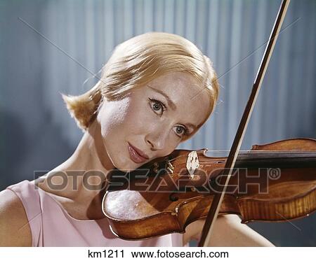 Stock Image - 1960S Blonde Woman Musician Playing Violin Retro . Fotosearch