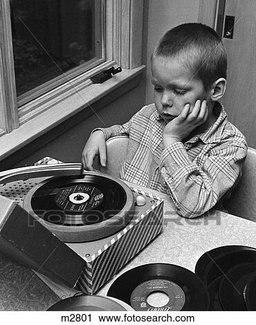 1960S Boy With Buzz Haircut Chin In Hand Sitting At Table Listening To Music On Small Portable 45 Rpm Phonograph Record Player View Large Photo Image Stock Image - 1960S Boy With Buzz Haircut Chin In Hand Sitting At Table Listening To Music On Small Portable 45 Rpm Phonograph Record Player. Fotosearch