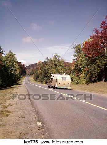1960S Car Pulling Rv Camper Down Country Road Adirondacks New York Autumn View Large Photo Image Stock Photography - 1960S Car Pulling Rv Camper Down Country Road Adirondacks New York Autumn . Fotosearch