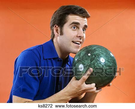 1960S Close-Up Of Young Man Holding Bowling Ball Ready To Bowl View Large Photo Image Stock Image - 1960S Close-Up Of Young Man Holding Bowling Ball Ready To Bowl. Fotosearch