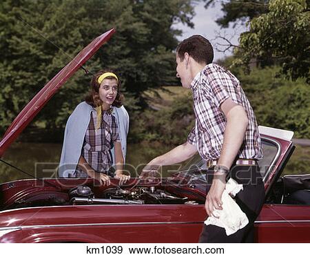 1960S Couple By Car With Hood Up Looking At Motor Man Woman Outdoor Problem Story Repair View Large Photo Image Stock Photo - 1960S Couple By Car With Hood Up Looking At Motor Man Woman Outdoor Problem Story Repair. Fotosearch