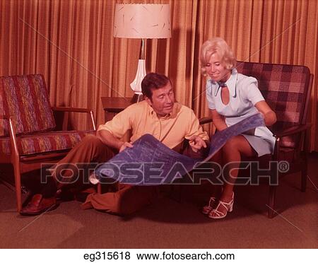 1960S Couple Holding Blueprints View Large Photo Image Stock Photo - 1960S Couple Holding Blueprints. Fotosearch
