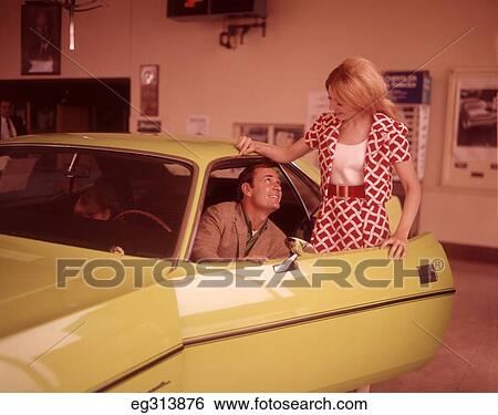1960S Couple In Automobile Showroom View Large Photo Image Stock Photograph - 1960S Couple In Automobile Showroom. Fotosearch