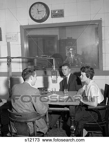 1960S Disc Jockey At Radio Station Mike Microphone Talk With Couple Man Woman At Table Man In Control Room View Large Photo Image Stock Image - 1960S Disc Jockey At Radio Station Mike Microphone Talk With Couple Man Woman At Table Man In Control Room . Fotosearch