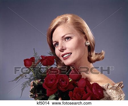 Picture - 1960S Elegant Blonde Woman Holding Bouquet Dozen Red Roses . Fotosearch