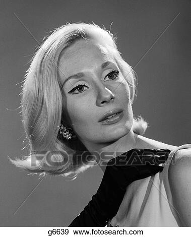 1960S Elegant Portrait Blonde With Black-Gloved Hand Resting On Shoulder & Head Tilted To Side View Large Photo Image Stock Photo - 1960S Elegant Portrait Blonde With Black-Gloved Hand Resting On Shoulder & Head Tilted To Side . Fotosearch