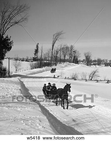 1960S Family Driving Down Rural Road In One-Horse Sleigh View Large Photo Image Stock Photo - 1960S Family Driving Down Rural Road In One-Horse Sleigh . Fotosearch