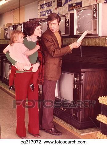 1960S Family Looking At Price Of Television Set View Large Photo Image Stock Image - 1960S Family Looking At Price Of Television Set. Fotosearch