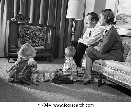1960S Family Mom Dad 2 Kids Watching Television View Large Photo Image Picture - 1960S Family Mom Dad 2 Kids Watching Television . Fotosearch
