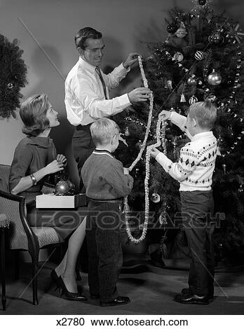 1960S Family Of 4 Trimming Tree View Large Photo Image Stock Image - 1960S Family Of 4 Trimming Tree . Fotosearch