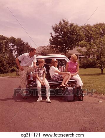 1960S Family Sitting On Back Station Wagon Loaded With Luggage For Vacation View Large Photo Image Stock Image - 1960S Family Sitting On Back Station Wagon Loaded With Luggage For Vacation. Fotosearch