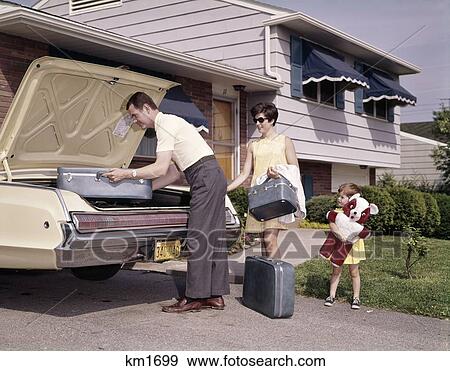 1960S Family With Little Daughter Loading Luggage Into Automobile Trunk For Vacation Man Woman Story View Large Photo Image Stock Photo - 1960S Family With Little Daughter Loading Luggage Into Automobile Trunk For Vacation Man Woman Story. Fotosearch