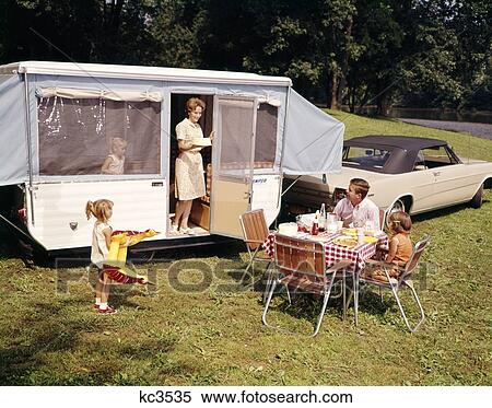 1960S Family With Three Daughters At Table By Automobile And Trailer Five Eating Food Vacation Man Woman Girl View Large Photo Image Stock Photography - 1960S Family With Three Daughters At Table By Automobile And Trailer Five Eating Food Vacation Man Woman Girl. Fotosearch