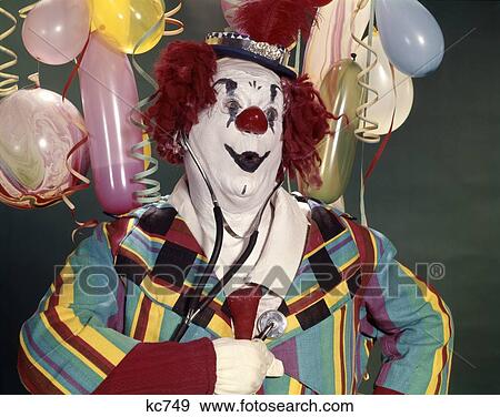1960S Fat Overweight Clown Listening To His Heart With A Medical Stethoscope Health Surprise Worry Concern Balloons View Large Photo Image Stock Photo - 1960S Fat Overweight Clown Listening To His Heart With A Medical Stethoscope Health Surprise Worry Concern Balloons . Fotosearch