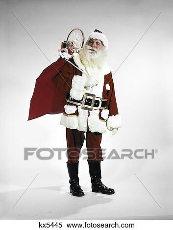 1960S Full Length Portrait Of Santa Claus With Stuffed Toy Sack On His Back Studio View Large Photo Image Stock Photography - 1960S Full Length Portrait Of Santa Claus With Stuffed Toy Sack On His Back Studio . Fotosearch