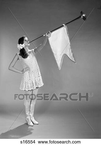 1960S Girl In Crocheted Dress White Boots And Fishnet Stockings Blowing Horn View Large Photo Image Picture - 1960S Girl In Crocheted Dress White Boots And Fishnet Stockings Blowing Horn . Fotosearch
